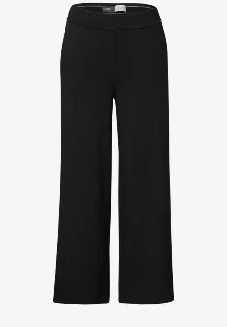 Schwarze, weite Damenhose mit elastischem Bund.