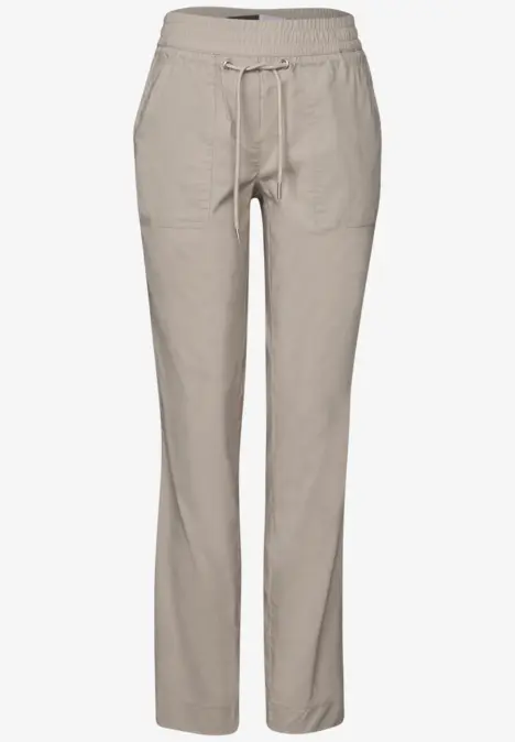 Beige Hose mit Gummibund und Kordelzug, zwei seitlichen Taschen.