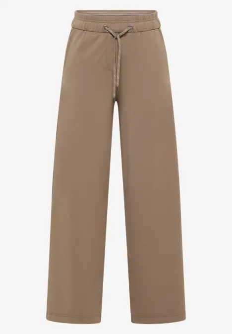 Beige, weite Jogginghose mit Kordelzug in der Taille.