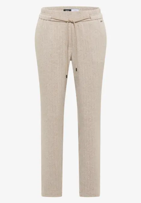 Beige Hose mit Kordelzugbund und schmalem Schnitt.