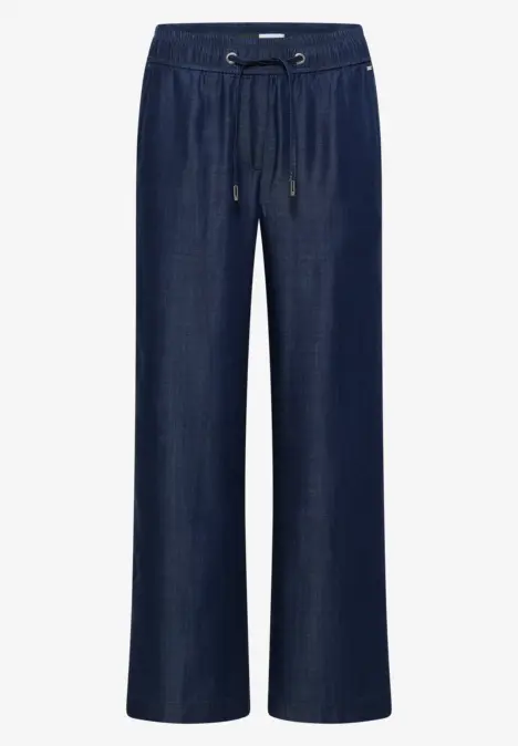 Dunkelblaue, weite Jeanshose mit elastischem Bund und Kordelzug.
