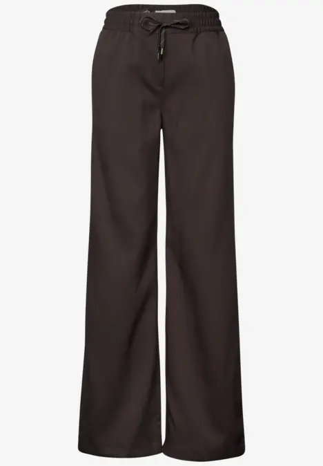 Zwarte, wijde loungebroek met elastische taille en trekkoord.