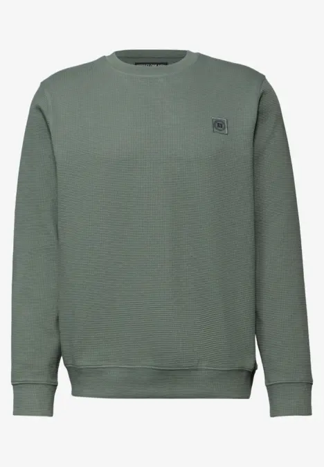 Einfaches olivgrünes Sweatshirt mit Rundhalsausschnitt und kleinem Logoprint auf der Brust.