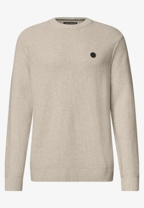Beige gebreide trui met ronde hals en reliëfmotief