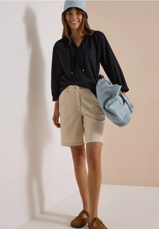Blouse à manches 3/4 avec col fendu en couleur unie
